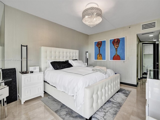 tiled bedroom with a notable chandelier