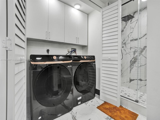 clothes washing area with hookup for an electric dryer, light tile floors, hookup for a washing machine, washer and clothes dryer, and cabinets