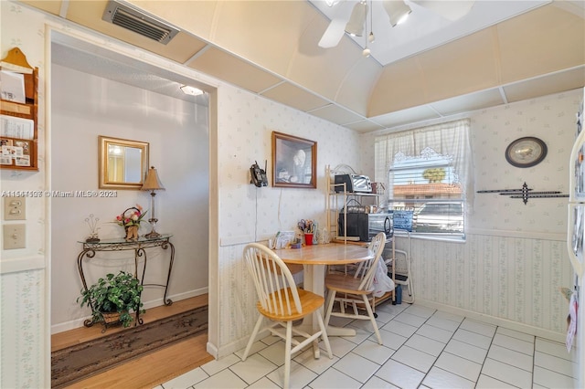 dining area with light tile floors and ceiling fan