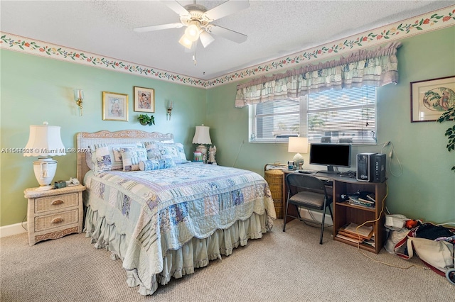 carpeted bedroom with ceiling fan and a textured ceiling