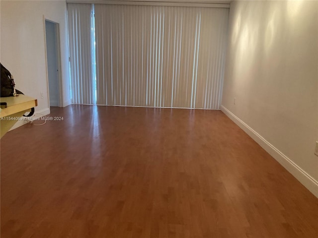 empty room featuring hardwood / wood-style flooring