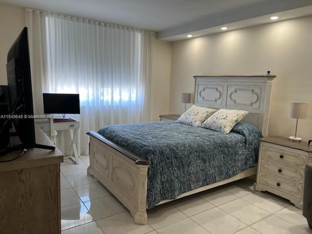 bedroom featuring light tile floors