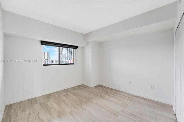 unfurnished room featuring light hardwood / wood-style flooring