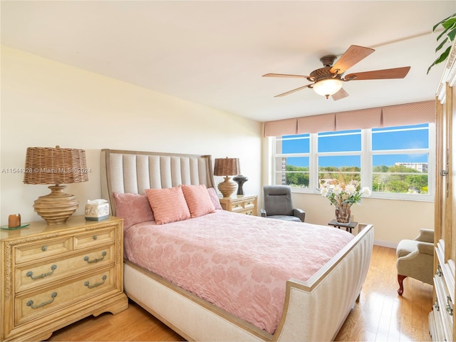 bedroom featuring ceiling fan and light hardwood / wood-style floors