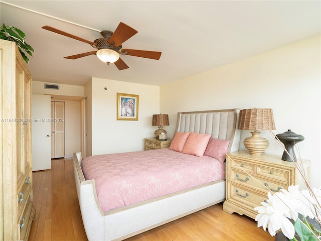 bedroom with wood-type flooring and ceiling fan