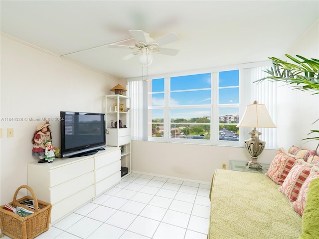 interior space with ceiling fan and crown molding