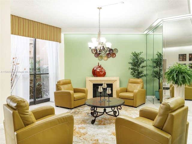 sitting room with tile patterned flooring and an inviting chandelier