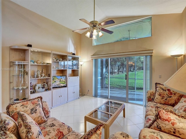 living room featuring light tile patterned floors, vaulted ceiling, and ceiling fan