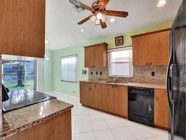 kitchen featuring ceiling fan, sink, black appliances, and a textured ceiling