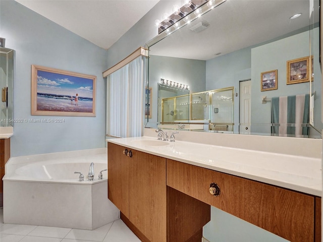 bathroom featuring tile patterned flooring, vanity, and plus walk in shower