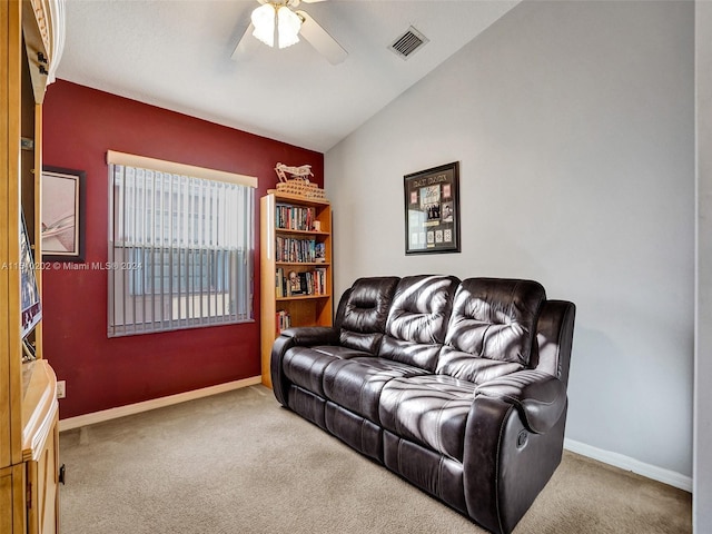 living room featuring ceiling fan, carpet, and lofted ceiling