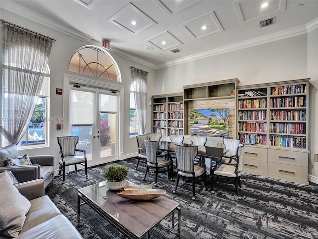 interior space with french doors, beam ceiling, ornamental molding, and coffered ceiling