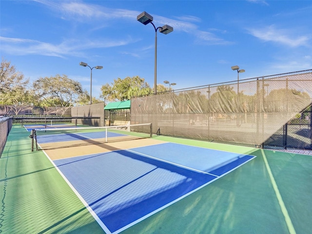 view of tennis court featuring basketball court