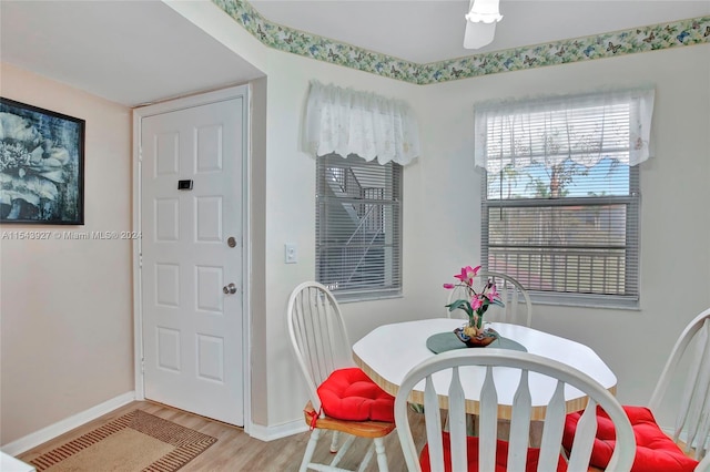 dining space with light hardwood / wood-style floors