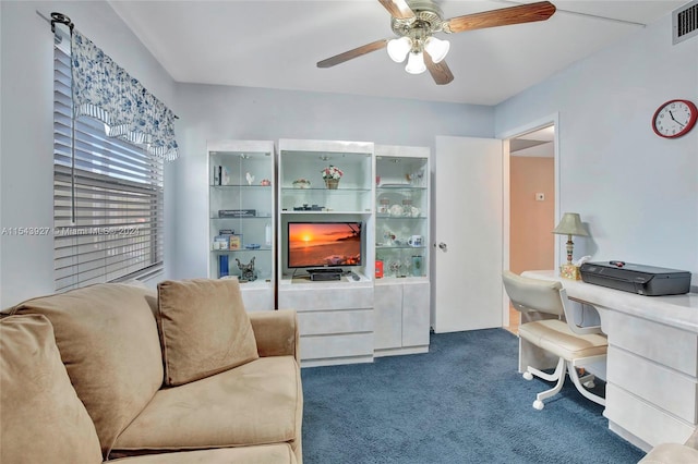 office featuring dark colored carpet and ceiling fan