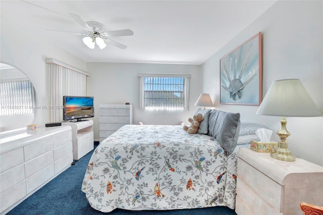 bedroom with dark colored carpet and ceiling fan