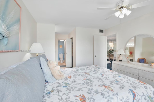 bedroom featuring ceiling fan and ensuite bathroom