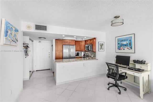 345 Ocean Dr Unit 411, Miami Beach, FL 33139 - home office featuring a textured ceiling and recessed lighting
