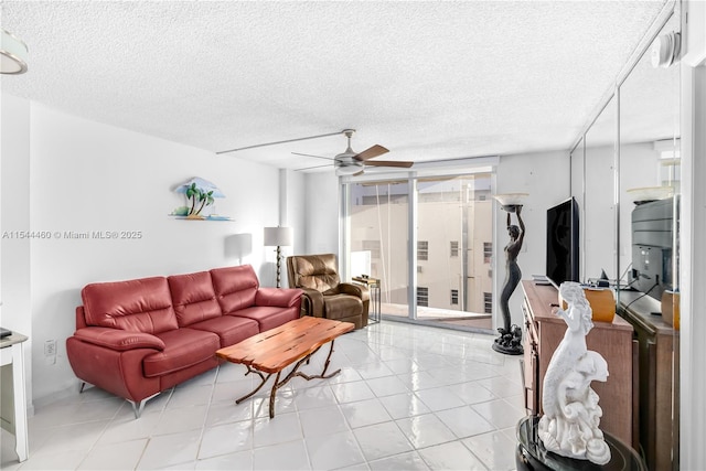 345 Ocean Dr Unit 411, Miami Beach, FL 33139 - living area with a ceiling fan, a textured ceiling, and floor to ceiling windows