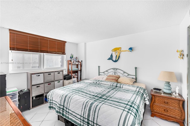 345 Ocean Dr Unit 411, Miami Beach, FL 33139 - bedroom with light tile patterned flooring and a textured ceiling