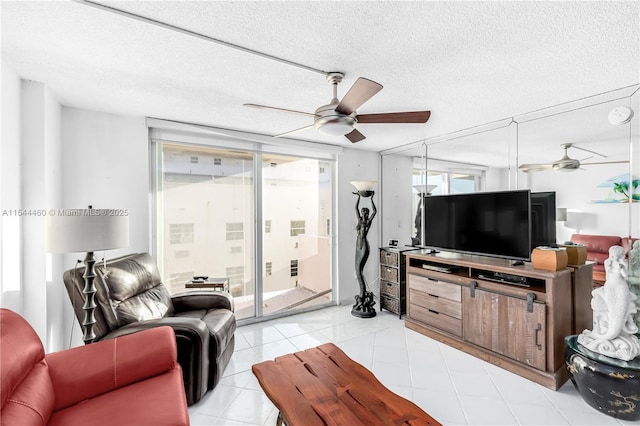 tiled living room with a textured ceiling and a healthy amount of sunlight