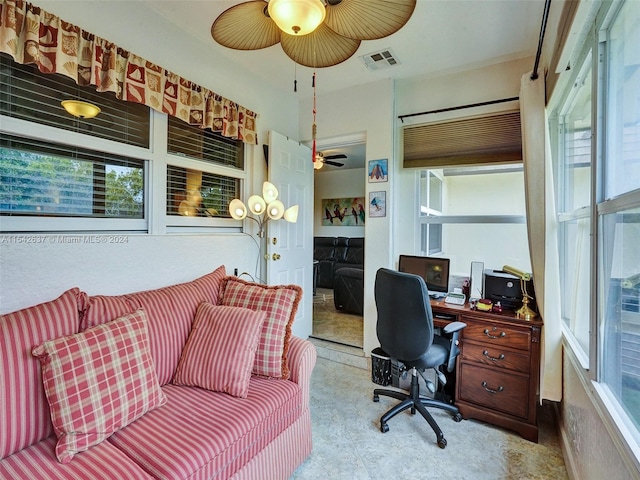 office area featuring light tile floors and ceiling fan