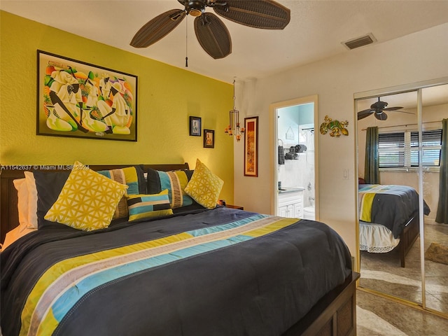 tiled bedroom with a closet and ceiling fan