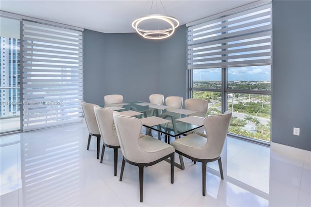 tiled dining room with expansive windows