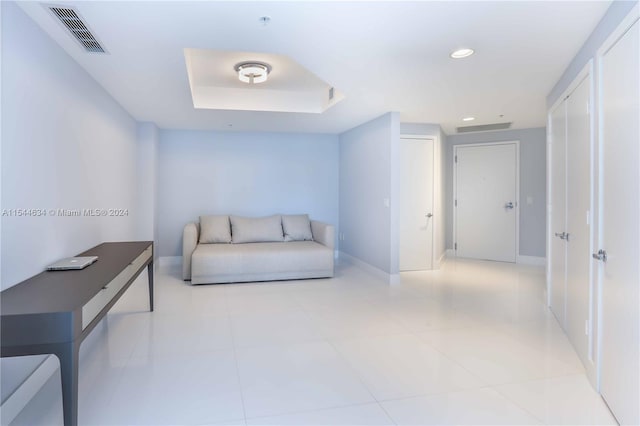 living area featuring light tile floors