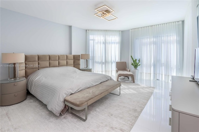 bedroom featuring light tile floors