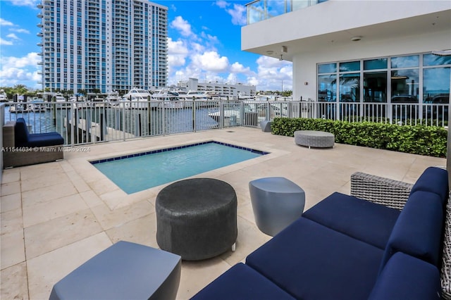 view of swimming pool featuring a patio