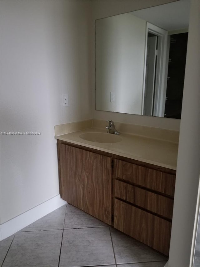 bathroom featuring tile floors and vanity