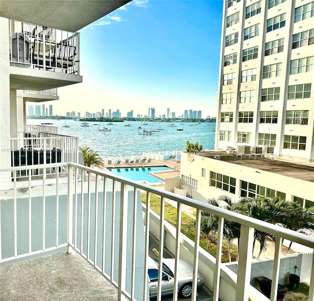 balcony featuring a water view