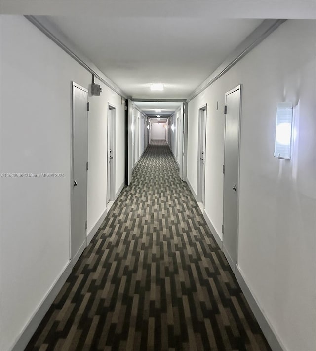 corridor with dark carpet