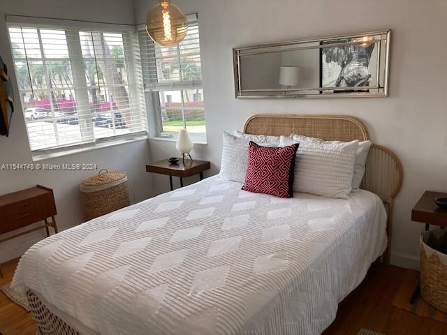 bedroom featuring dark wood-type flooring