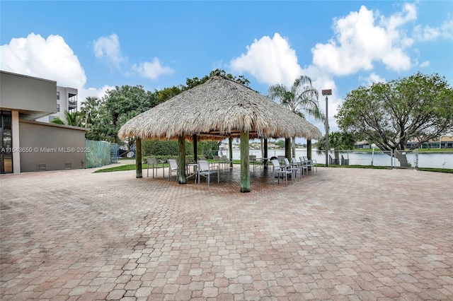 view of home's community featuring a water view and a gazebo