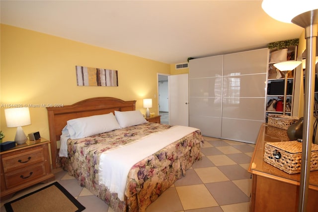 bedroom with light tile floors