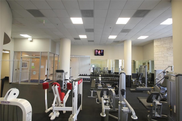 gym featuring a drop ceiling