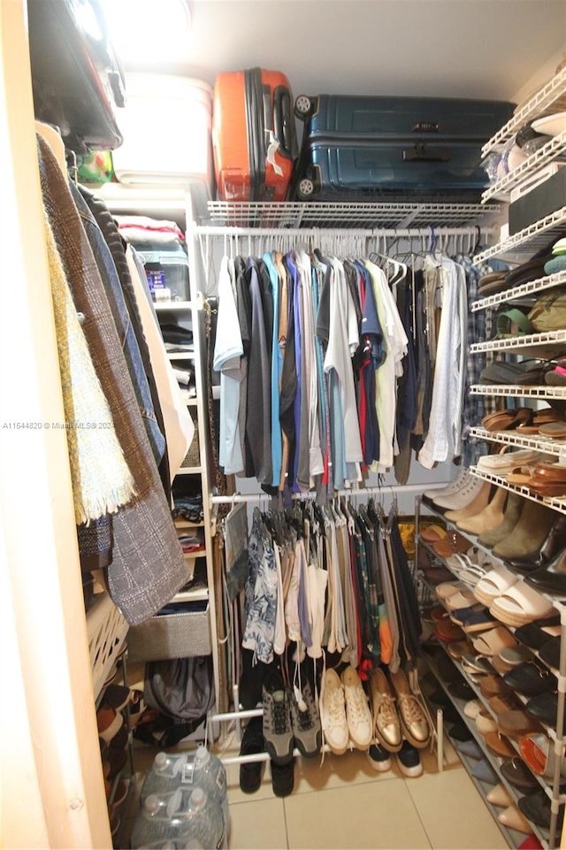 spacious closet featuring tile floors