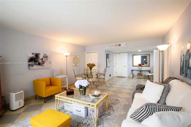 living room featuring light tile flooring