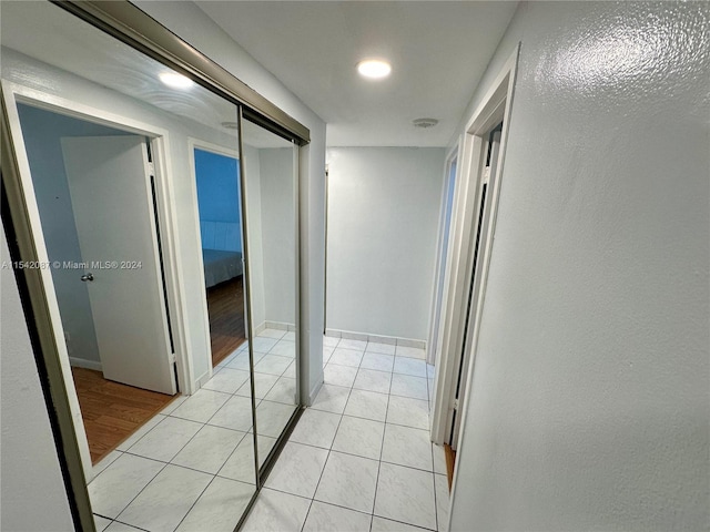 corridor with light tile flooring