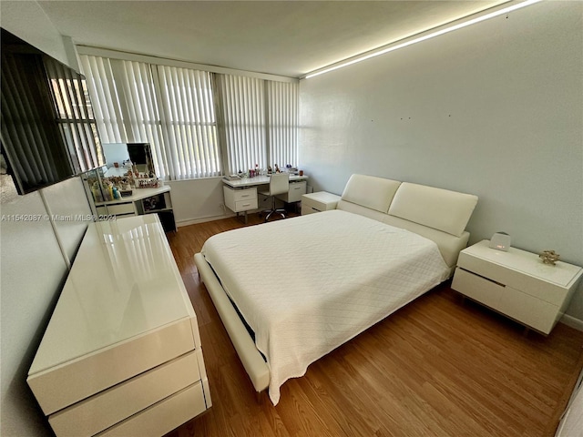 bedroom featuring dark hardwood / wood-style floors