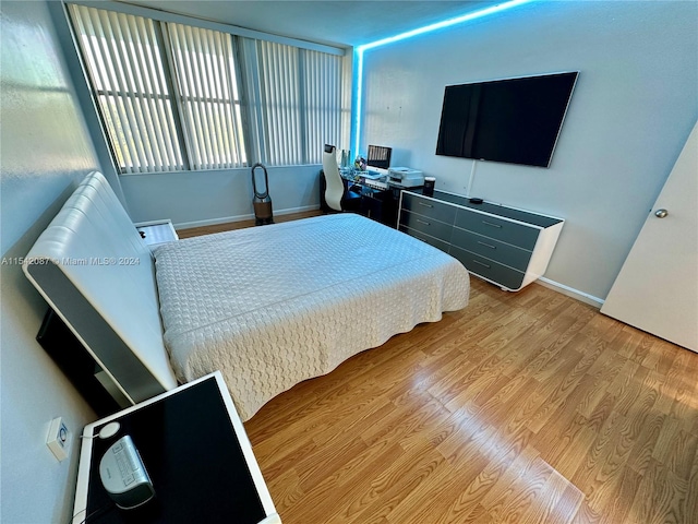 bedroom with light wood-type flooring