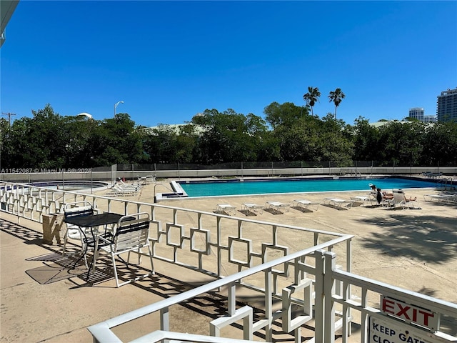 view of swimming pool with a patio