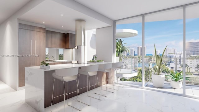 kitchen with sink, black gas cooktop, kitchen peninsula, floor to ceiling windows, and a breakfast bar area