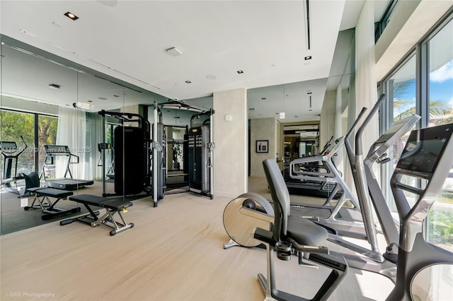 9901 W Bay Harbor Dr Unit 303, Bay Harbor Islands, FL 33154 - exercise room featuring light wood-style floors