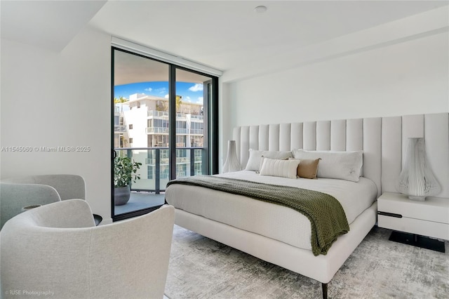9901 W Bay Harbor Dr Unit 303, Bay Harbor Islands, FL 33154 - bedroom featuring expansive windows and access to outside