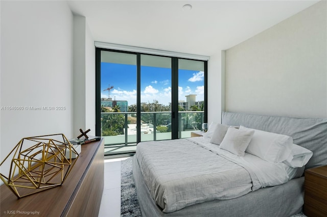 9901 W Bay Harbor Dr Unit 303, Bay Harbor Islands, FL 33154 - bedroom with a wall of windows and access to exterior