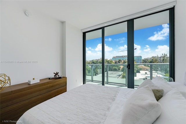 9901 W Bay Harbor Dr Unit 303, Bay Harbor Islands, FL 33154 - bedroom featuring a wall of windows, access to exterior, and a city view