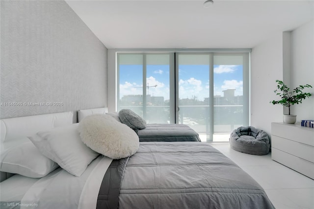 9901 W Bay Harbor Dr Unit 303, Bay Harbor Islands, FL 33154 - bedroom with expansive windows, tile patterned floors, a city view, and access to outside